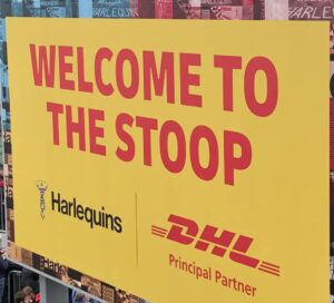 'Welcome To The Stoop' board with Harlequins and DHK Principal Partner.